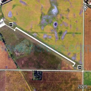 Aerial image of the airport with runways marked.